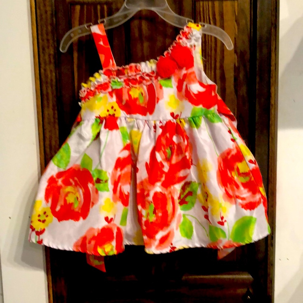 A symmetrical Pinky dress size 2T